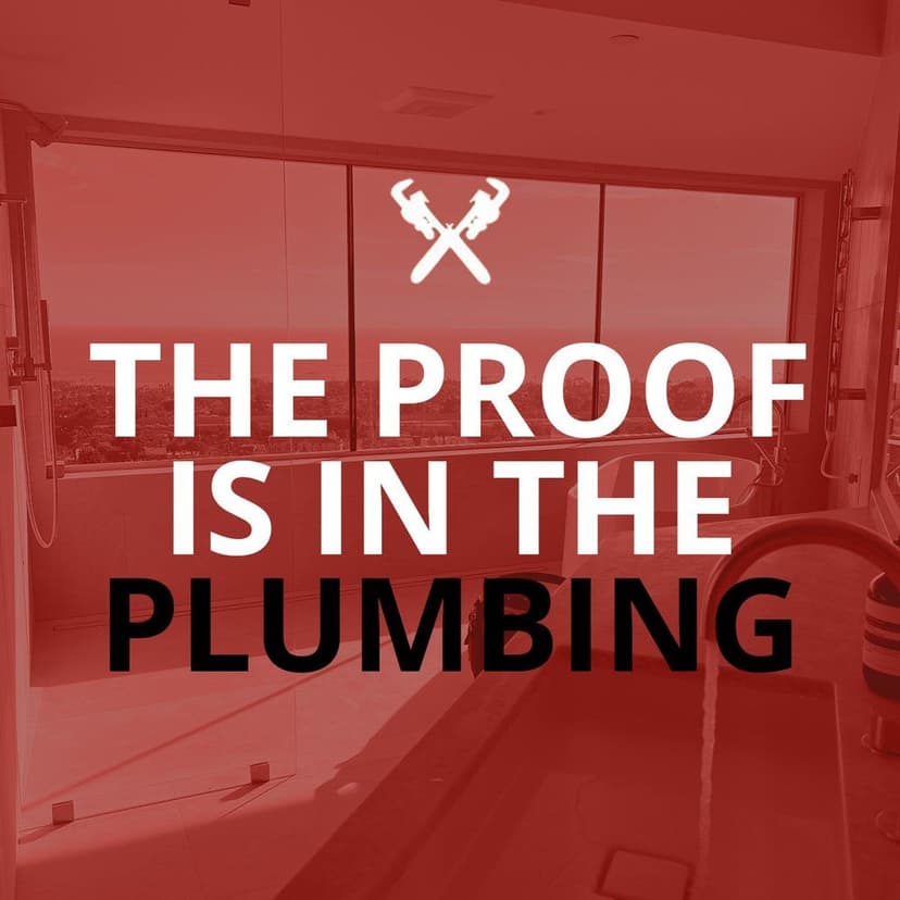 Modern bathroom with panoramic views and bold text: "The Proof Is In The Plumbing."