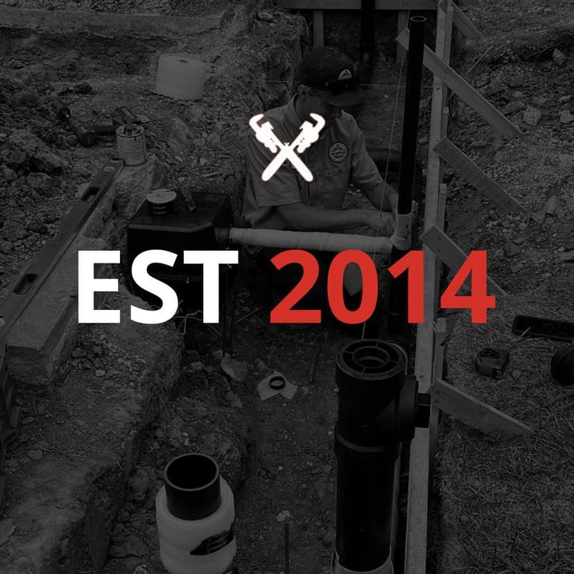 Plumber installing pipes in trench with established date 2014, tools symbol above.