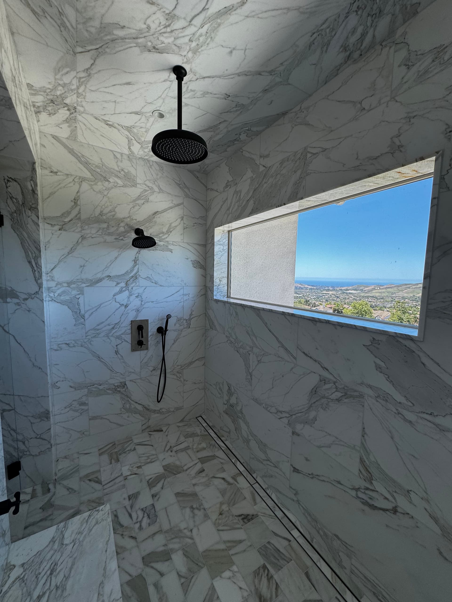 Gallery photos for His-and-Hers Marble Shower Build with a View: Image #1