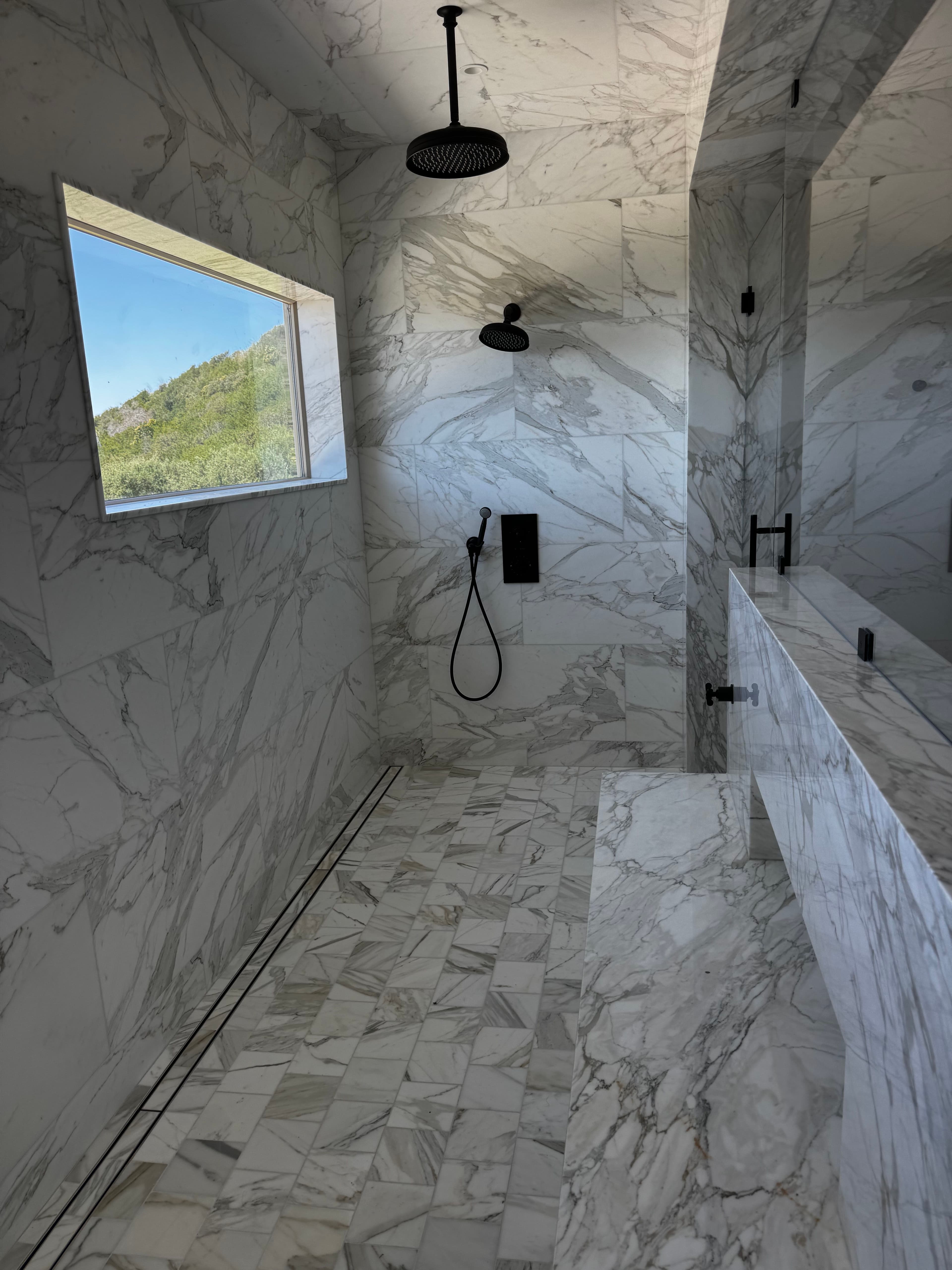 Project His-and-Hers Marble Shower Build with a View image